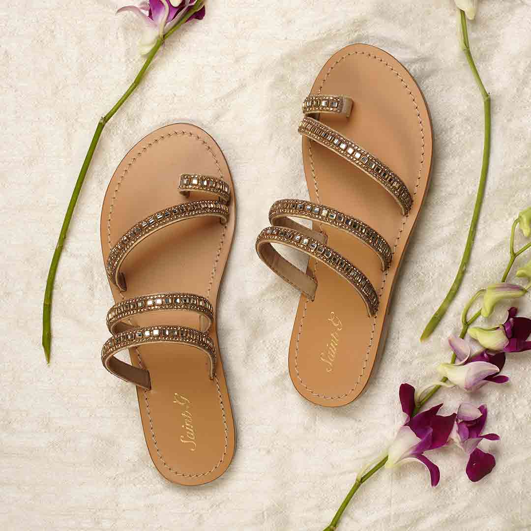 Gold flat sandals with stone-embellished straps for a wedding or special occasion