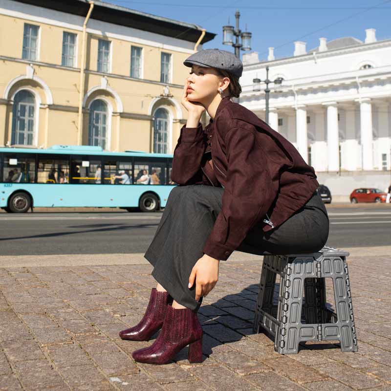 Saint Edwina burgundy ankle boots with charcoal trousers and a burgundy jacket