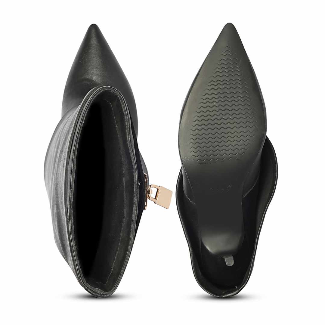 Black pointed-toe ankle boots shown from the side and sole views