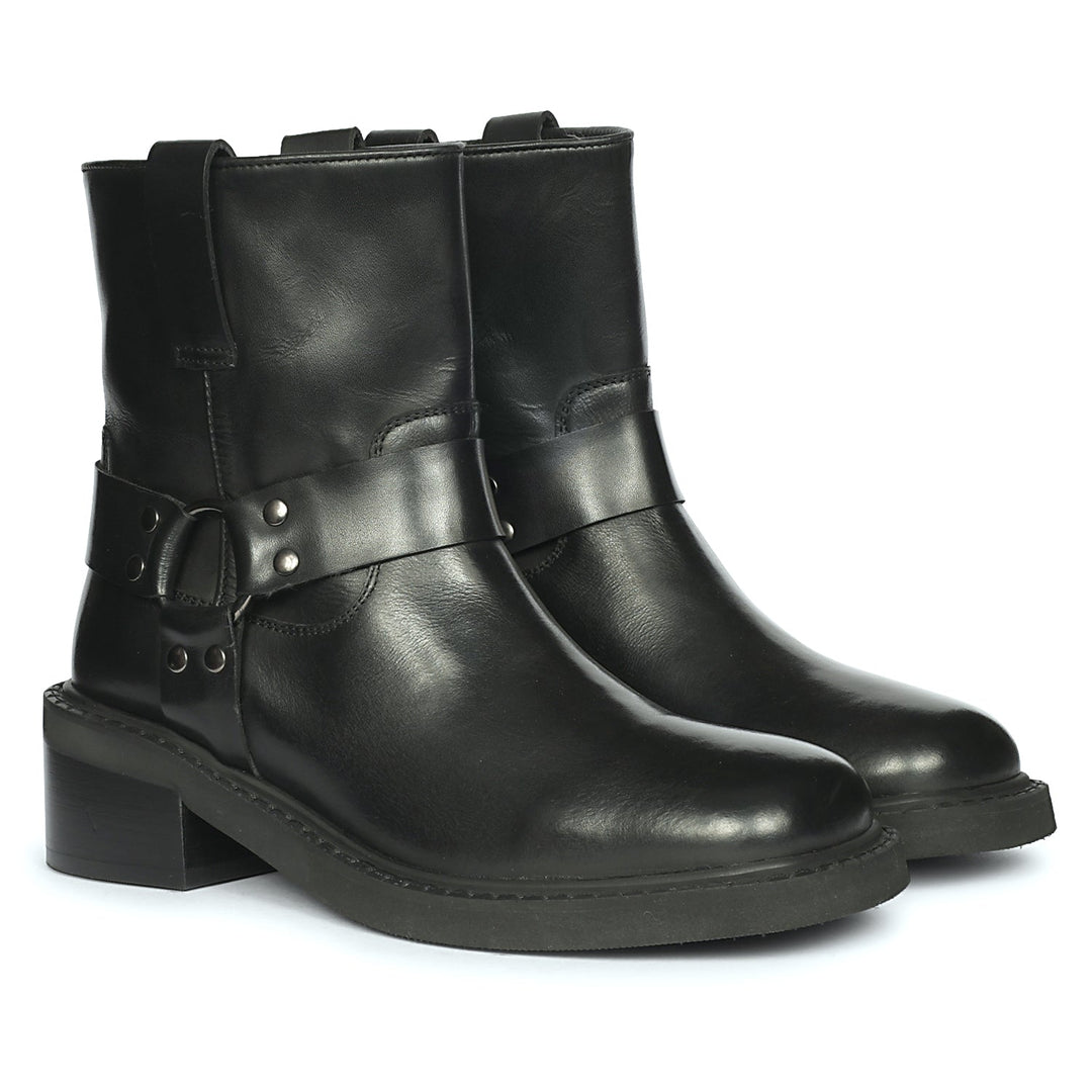 Pair of black leather high ankle boots featuring O-ring harness straps and sturdy block heels