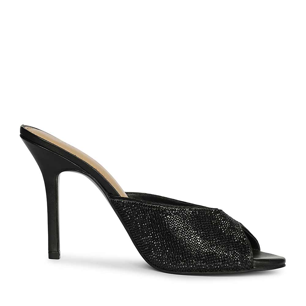 Black stiletto-heeled shoe with open toe on a white background