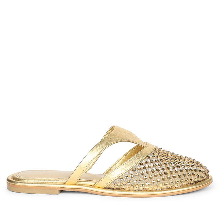 Side view of metallic gold mule flats with crystal mesh detailing