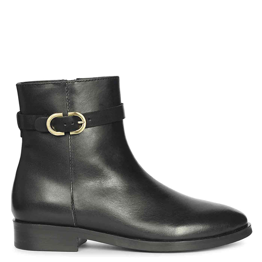 Black leather ankle boot with a gold buckle strap on the side