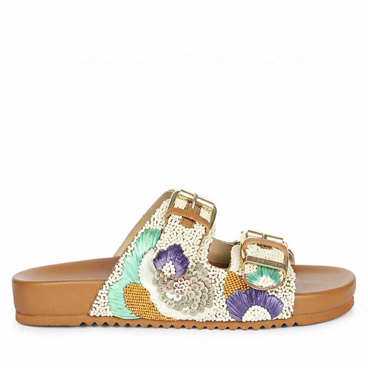 Side view of embroidered tan leather footbed sandals with premium craftsmanship