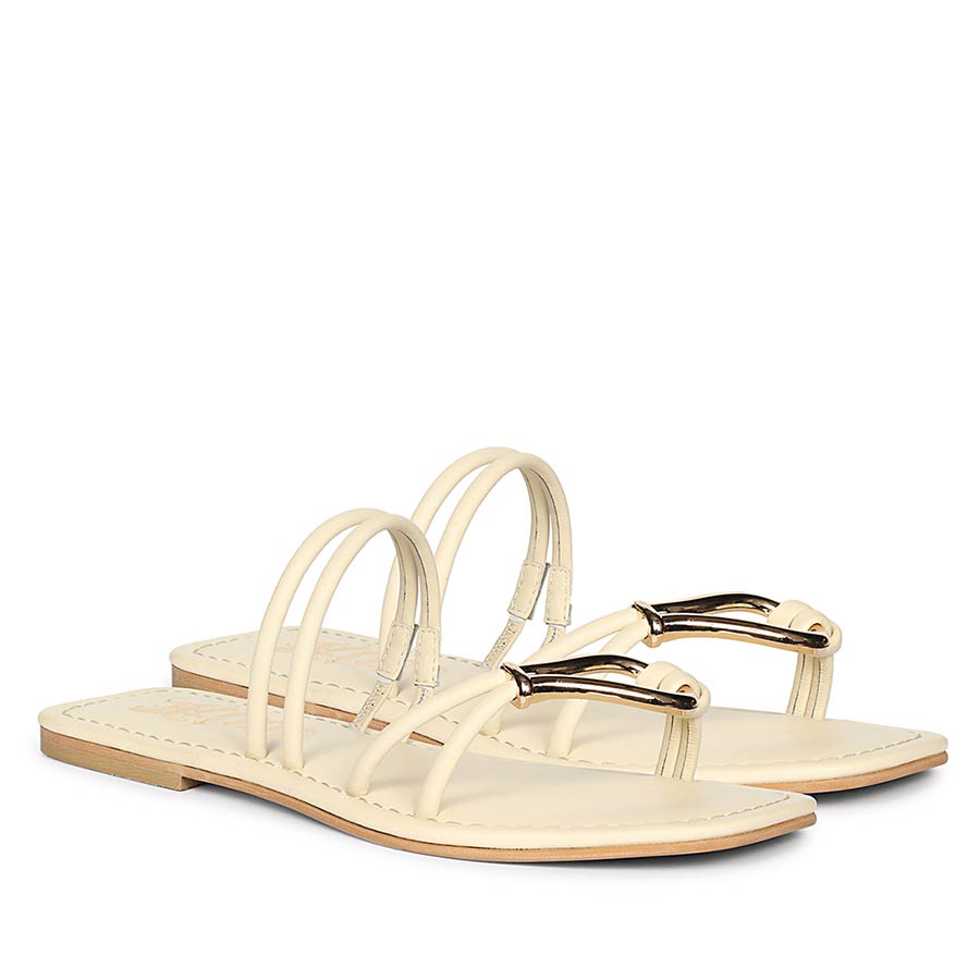 Off white leather flats with metal