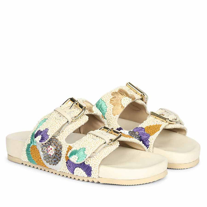 Elegant off-white embroidered leather sandals styled for summer occasions