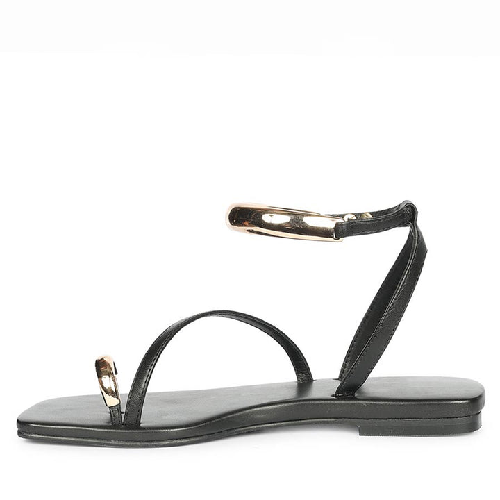 Black leather sandals with gold detail