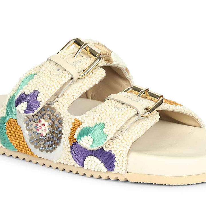 Off-white leather footbed sandals with embroidered detailing and cushioned comfort