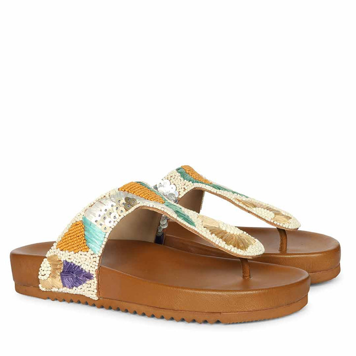 Premium tan leather thong sandals paired for effortless summer outfits