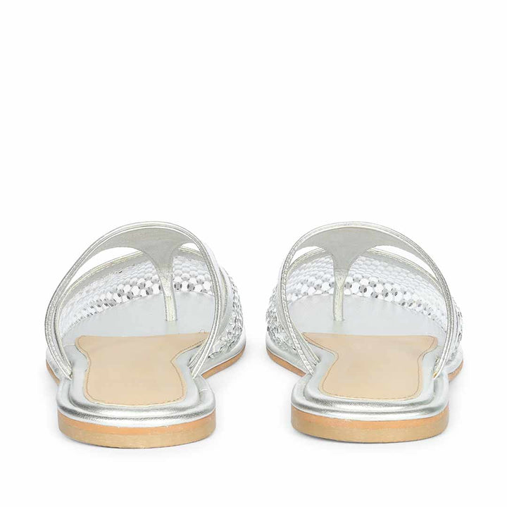Back view of silver leather mule flats with luxury evening styling