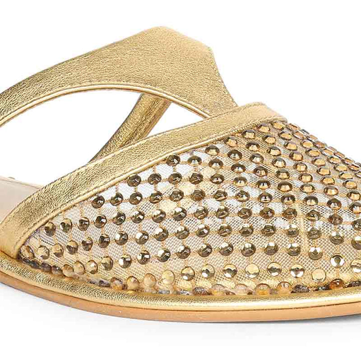Gold sandal with mesh design and rhinestone embellishments on a white background