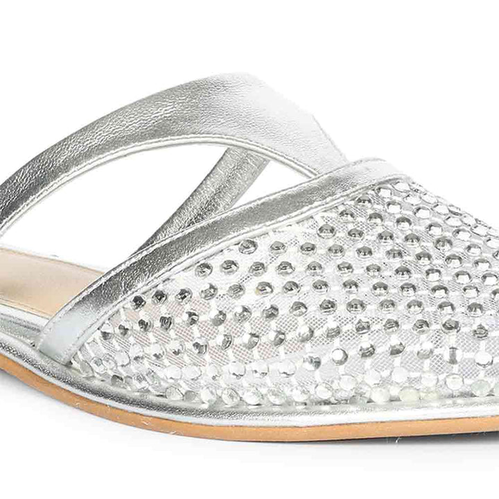 Silver sandal with rhinestone embellishments on a white background