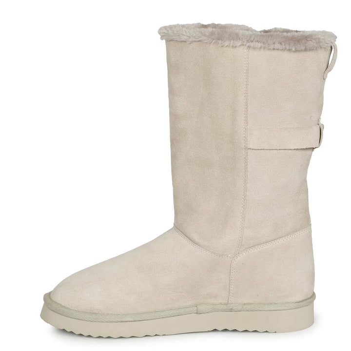 Chic ivory suede boots with decorative buckle, crafted by Saint Aurelia for snug comfort and style