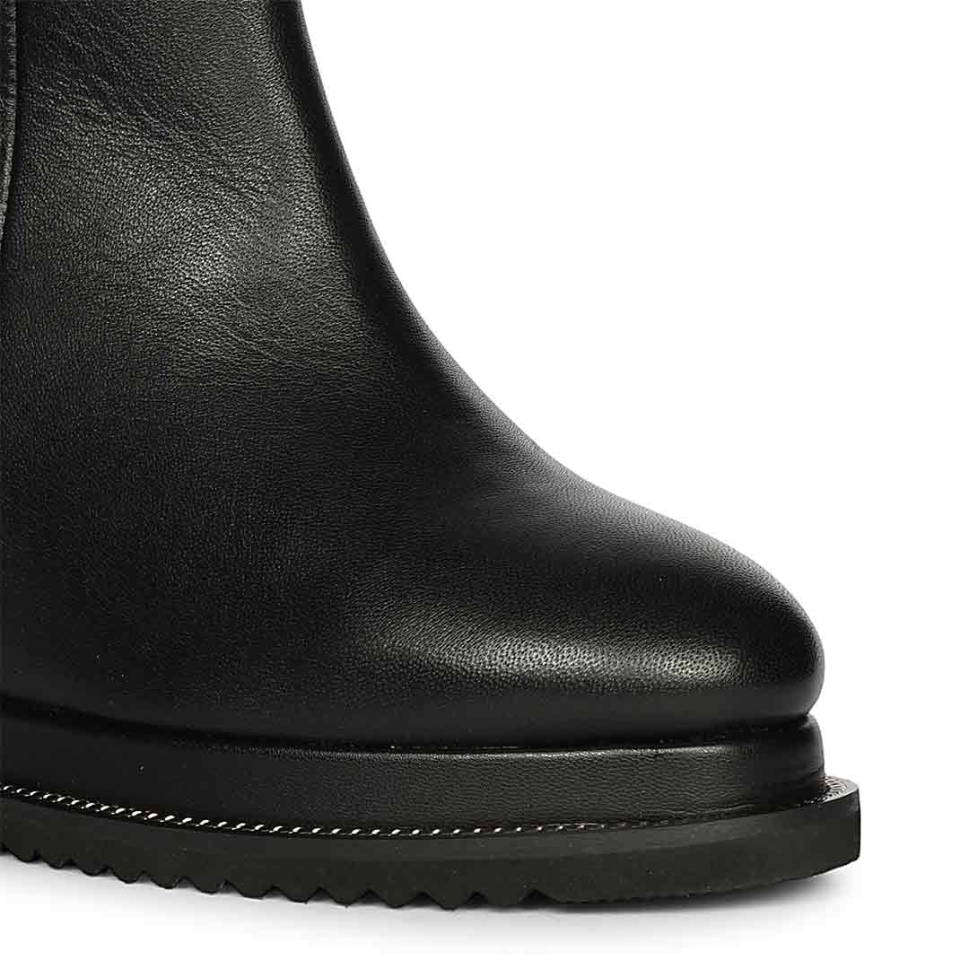 Black leather wedge ankle boots for women, side view