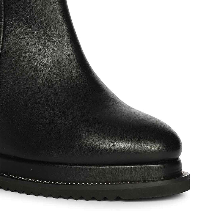 Black leather wedge ankle boots for women, side view