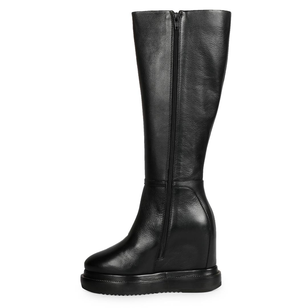 Black leather wedge long boots for women with chain detail, angled view