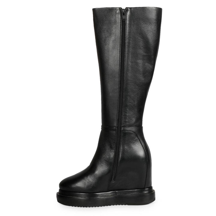 Black leather wedge long boots for women with chain detail, angled view