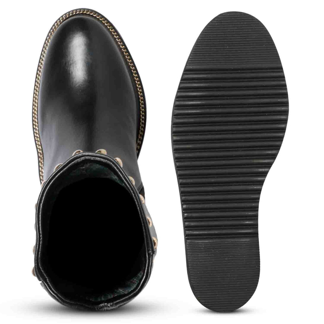 Sole and inside wedge of womens black studded leather long boots