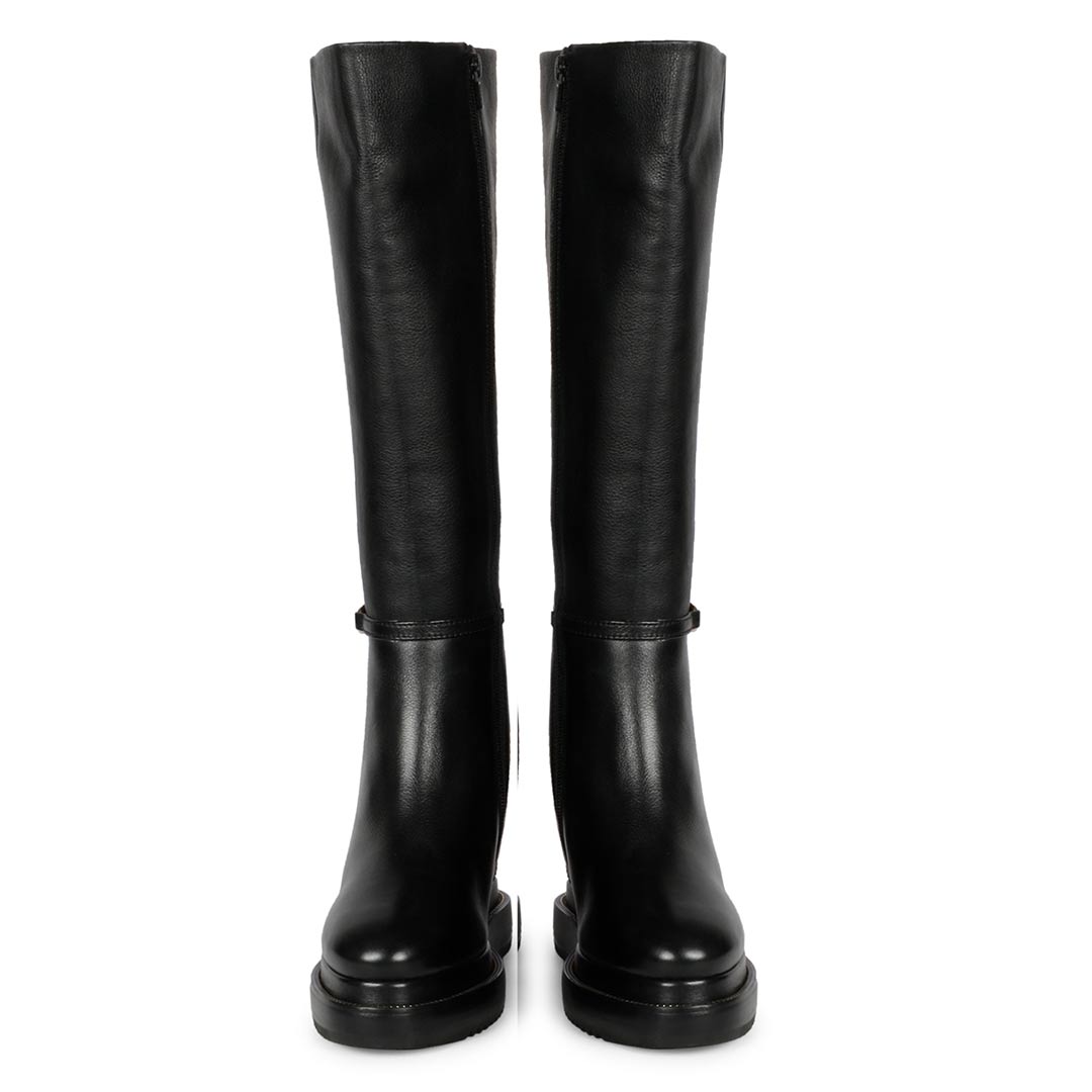 Pair of womens black leather wedge long boots with chain detail