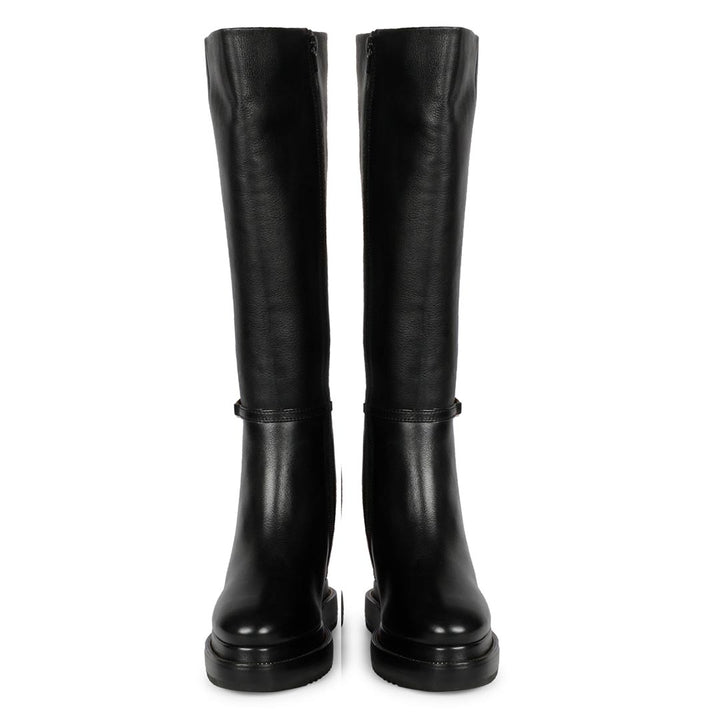 Pair of womens black leather wedge long boots with chain detail