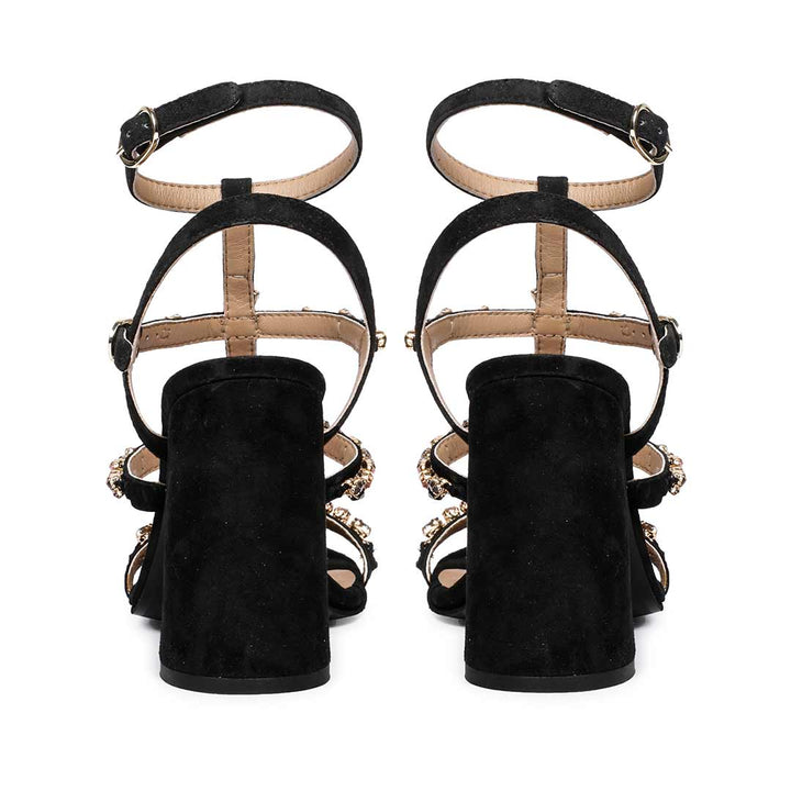 Striking black heels with intricate stone detailing by Saint Gretel.