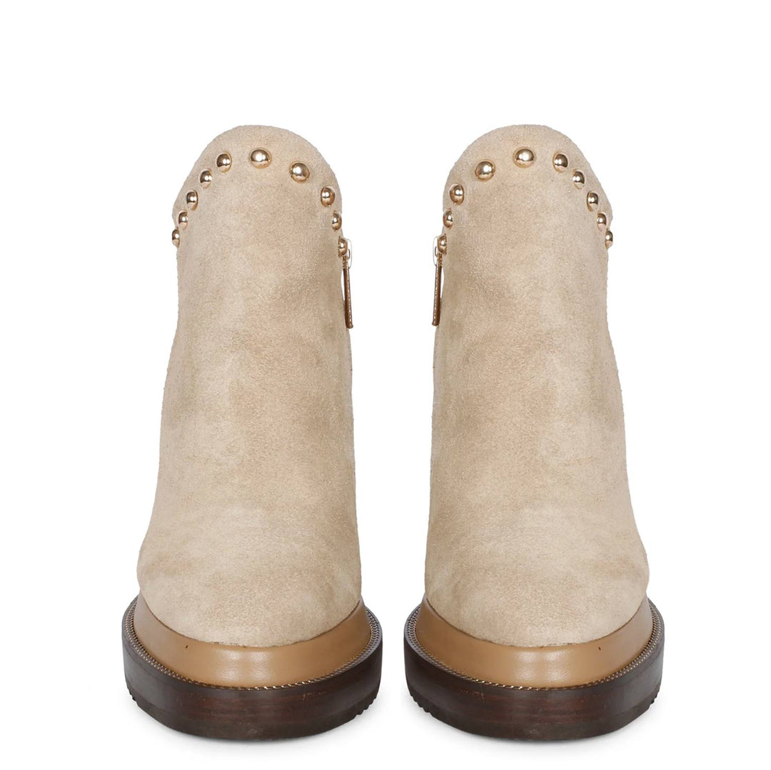 Pair of ladies beige suede wedge ankle boots, front view