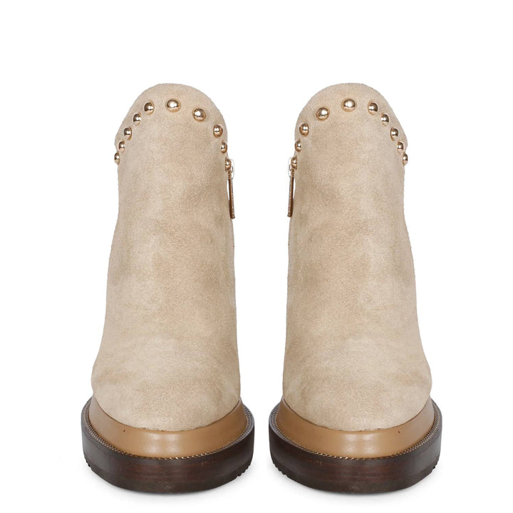Pair of ladies beige suede wedge ankle boots, front view