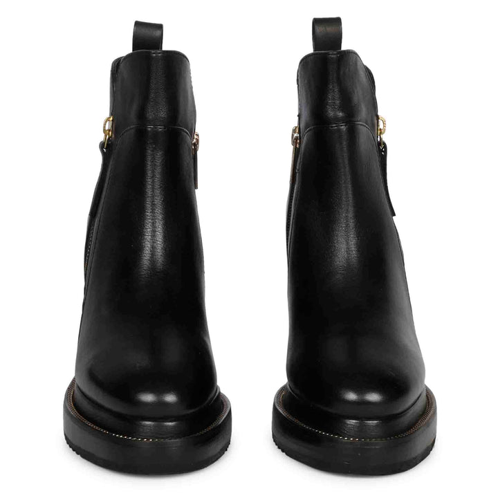 Pair of ladies black leather wedge ankle boots, front view