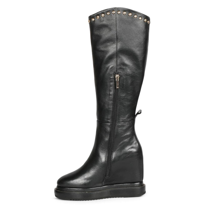 Ladies black studded leather wedge long boots, left angle view