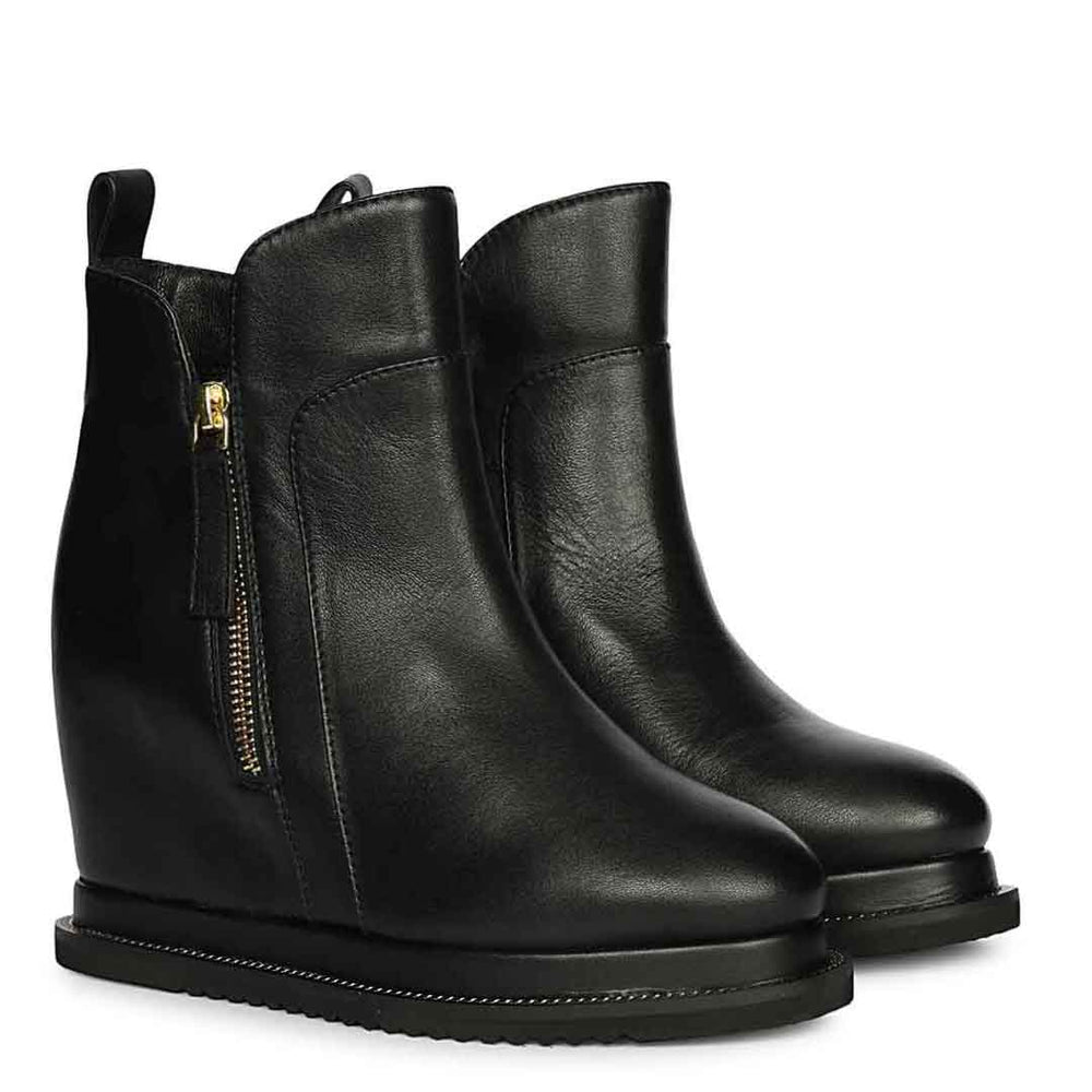 Ladies black leather wedge ankle boots with gold zip, front angled view