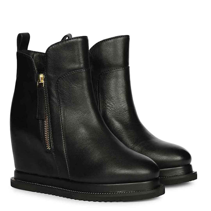 Ladies black leather wedge ankle boots with gold zip, front angled view