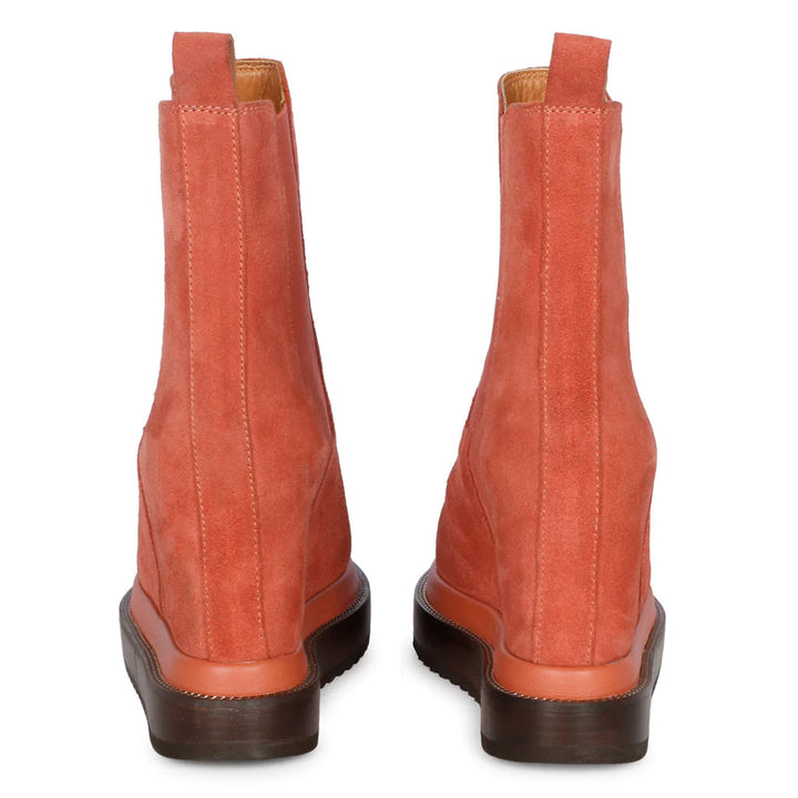 Pair of ladies coral suede wedge ankle boots, back view