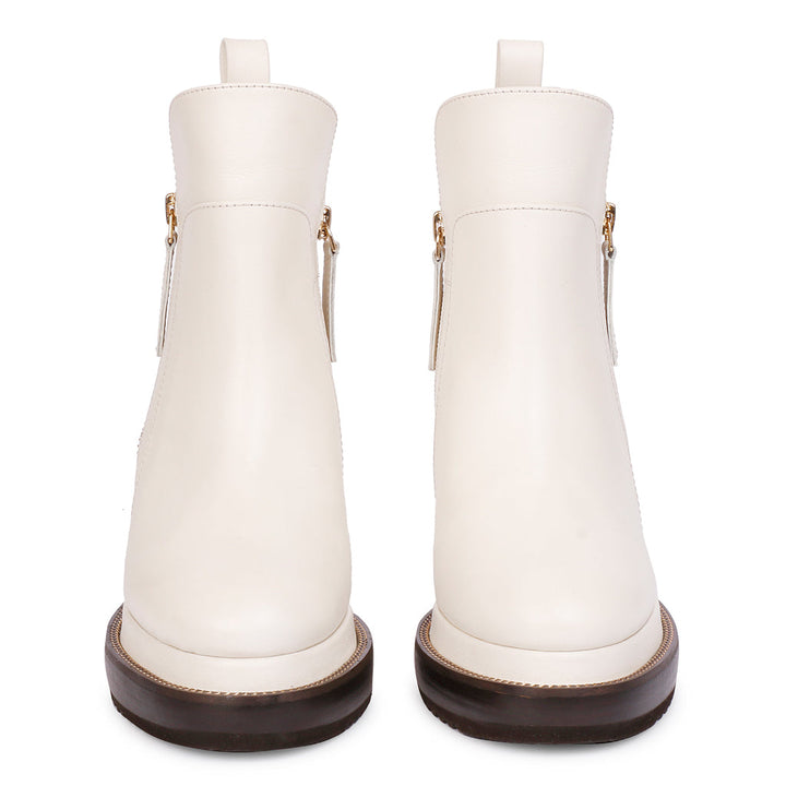 Pair of ladies off-white leather wedge ankle boots, front view