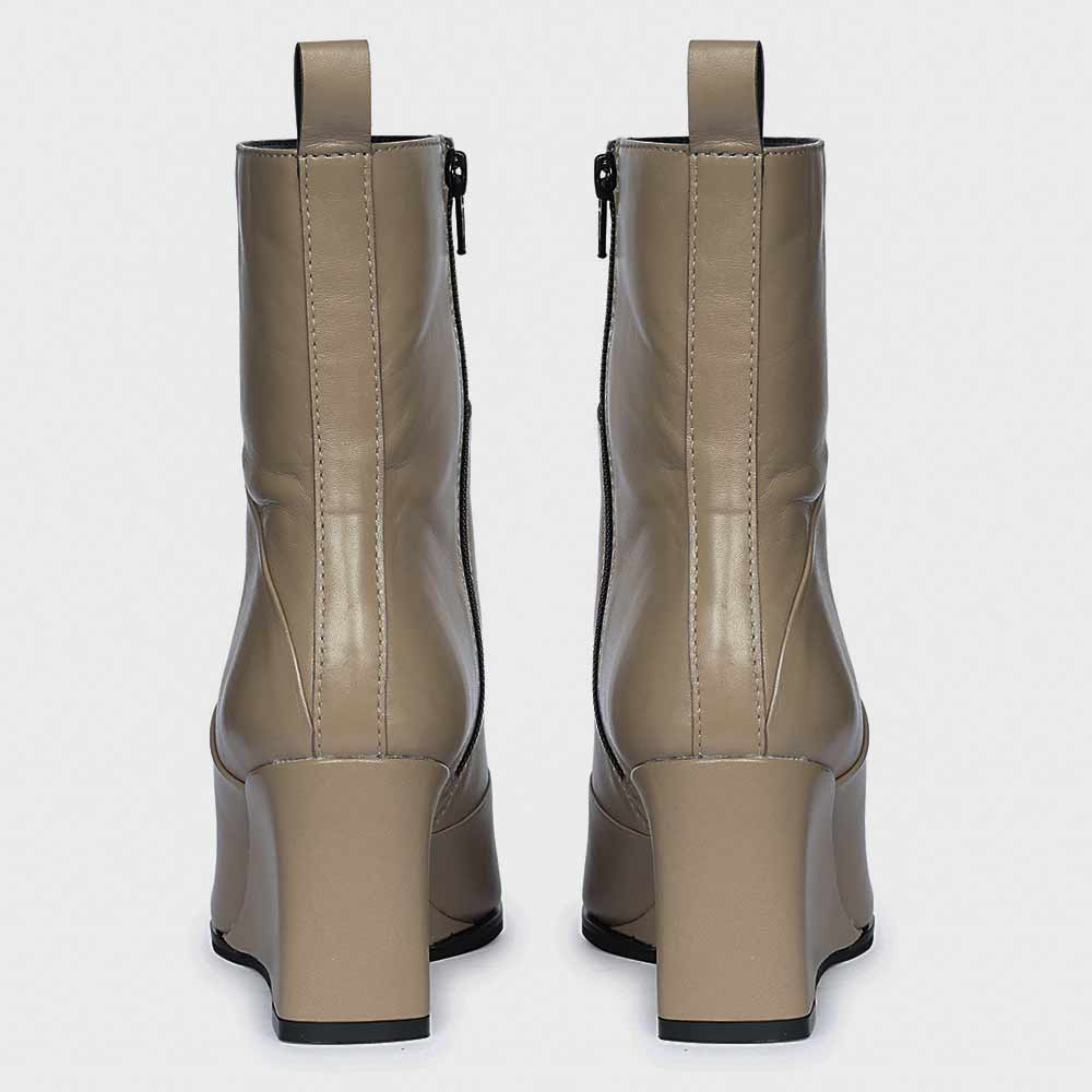 Pair of ladies stone leather wedge ankle boots, back view