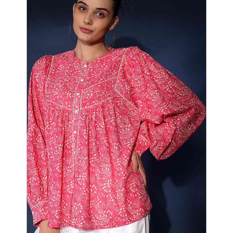 Close-up of button placket and collarless neckline on Saint Adara pink floral voile top for women UK.