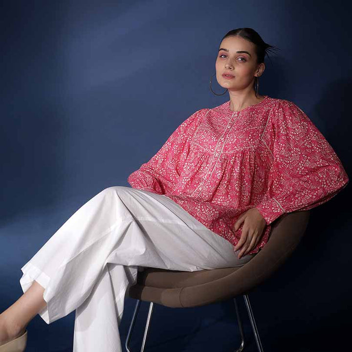 Saint Adara pink floral voile top for women UK, seated lifestyle view.