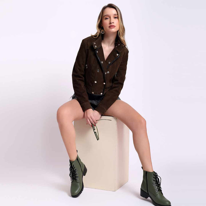 Olive suede biker jacket for women UK, styled seated lifestyle shot