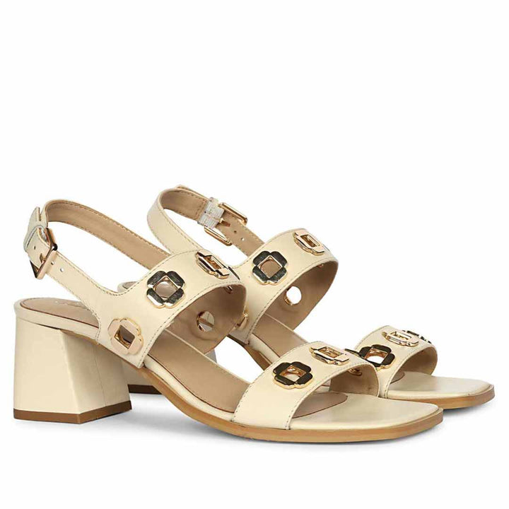 Off white low block heel sandals for women with gold buckle detail – pair angle view