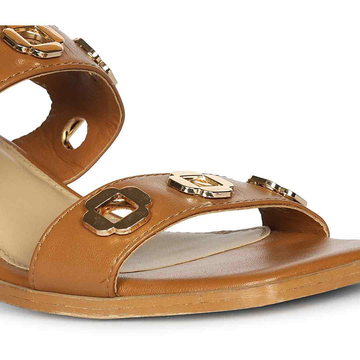 Low block heel sandals tan leather gold flower eyelet – close-up detail