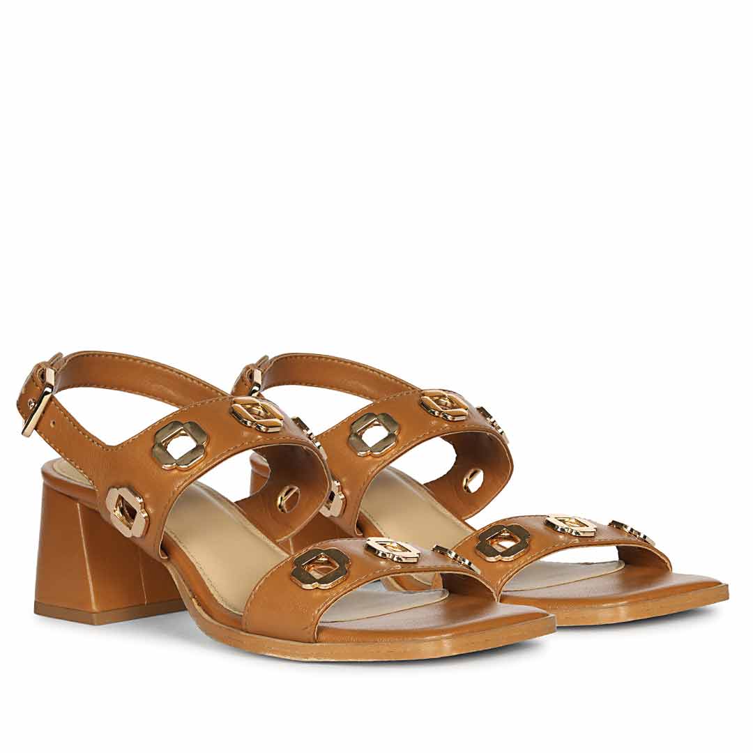 Tan low block heel sandals gold eyelet detail –pair angle view