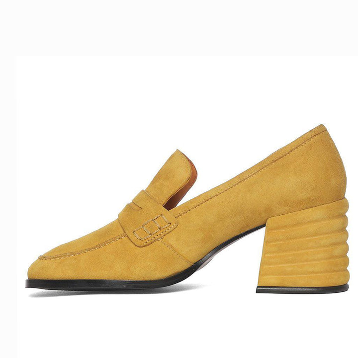 Women's mustard suede shoe detail, penny strap and stitching close-up, UK