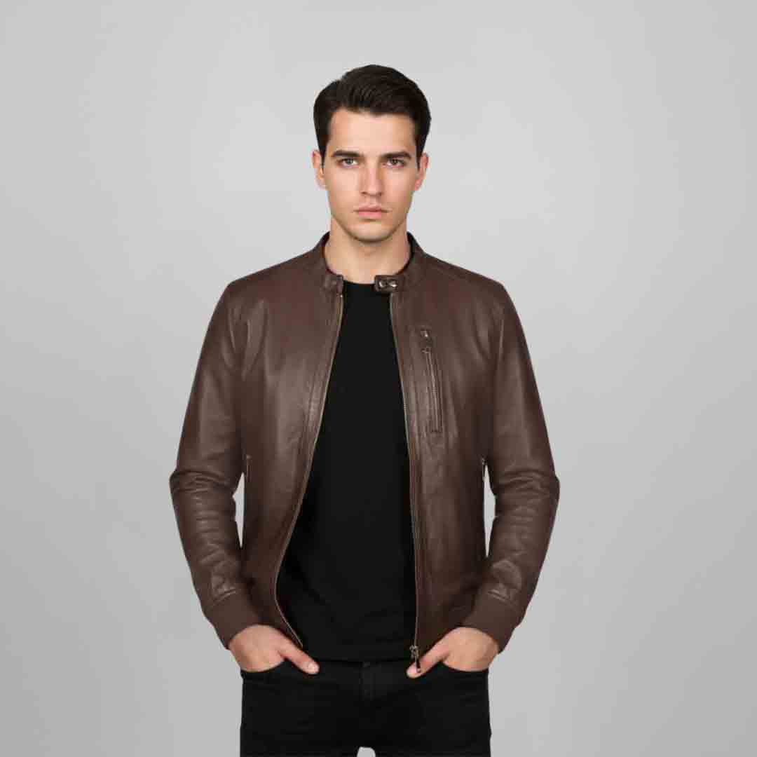 Man wearing an open brown leather bomber jacket over a black top.