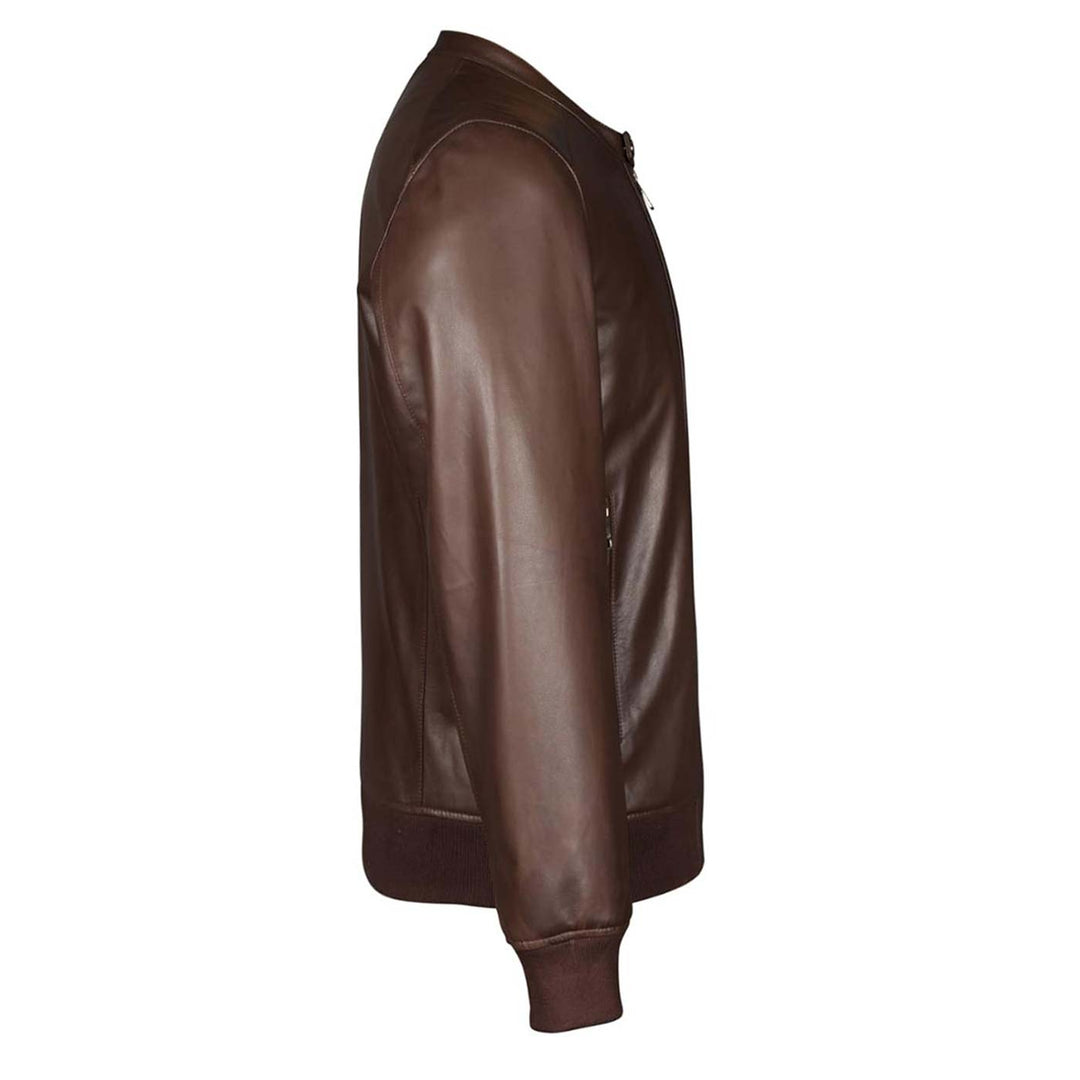 Close-up side view of a brown leather bomber jacket's sleeve and shoulder seam.