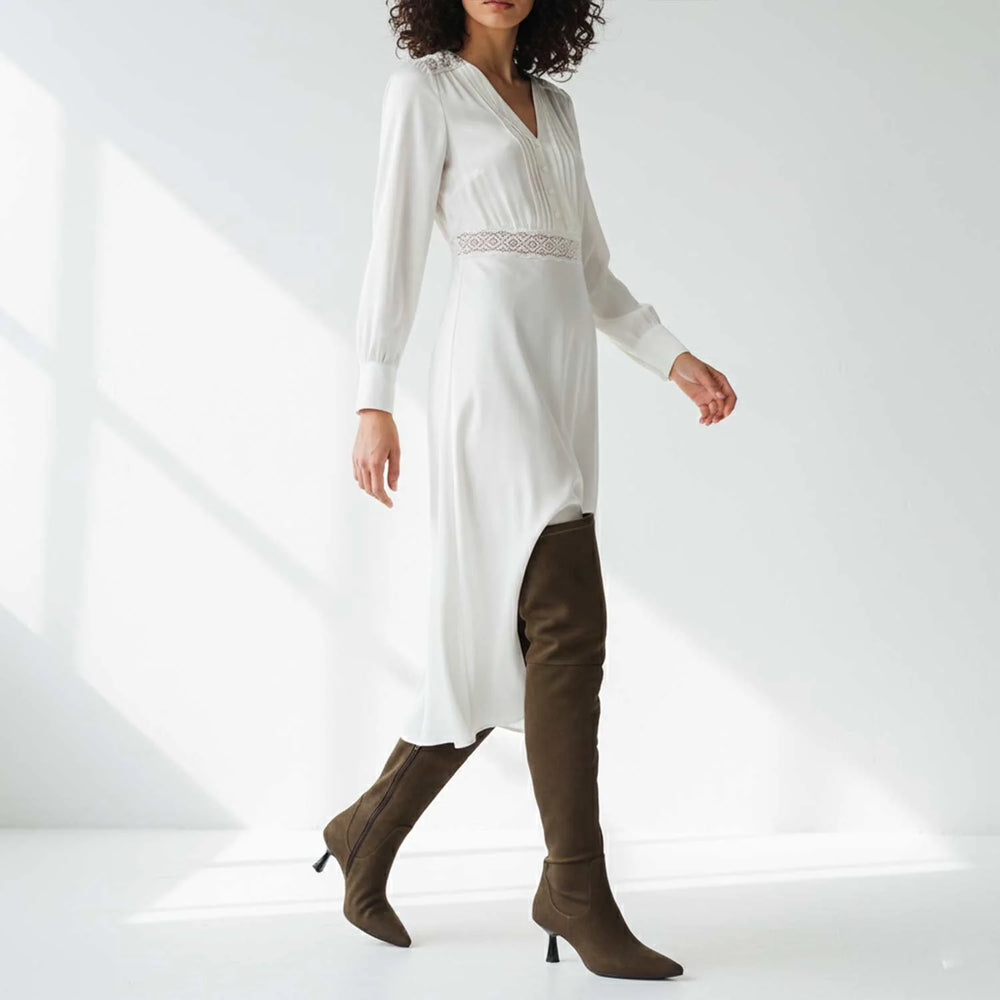 Women's olive suede thigh high boots UK by Saint Annelise, styled walking lifestyle shot