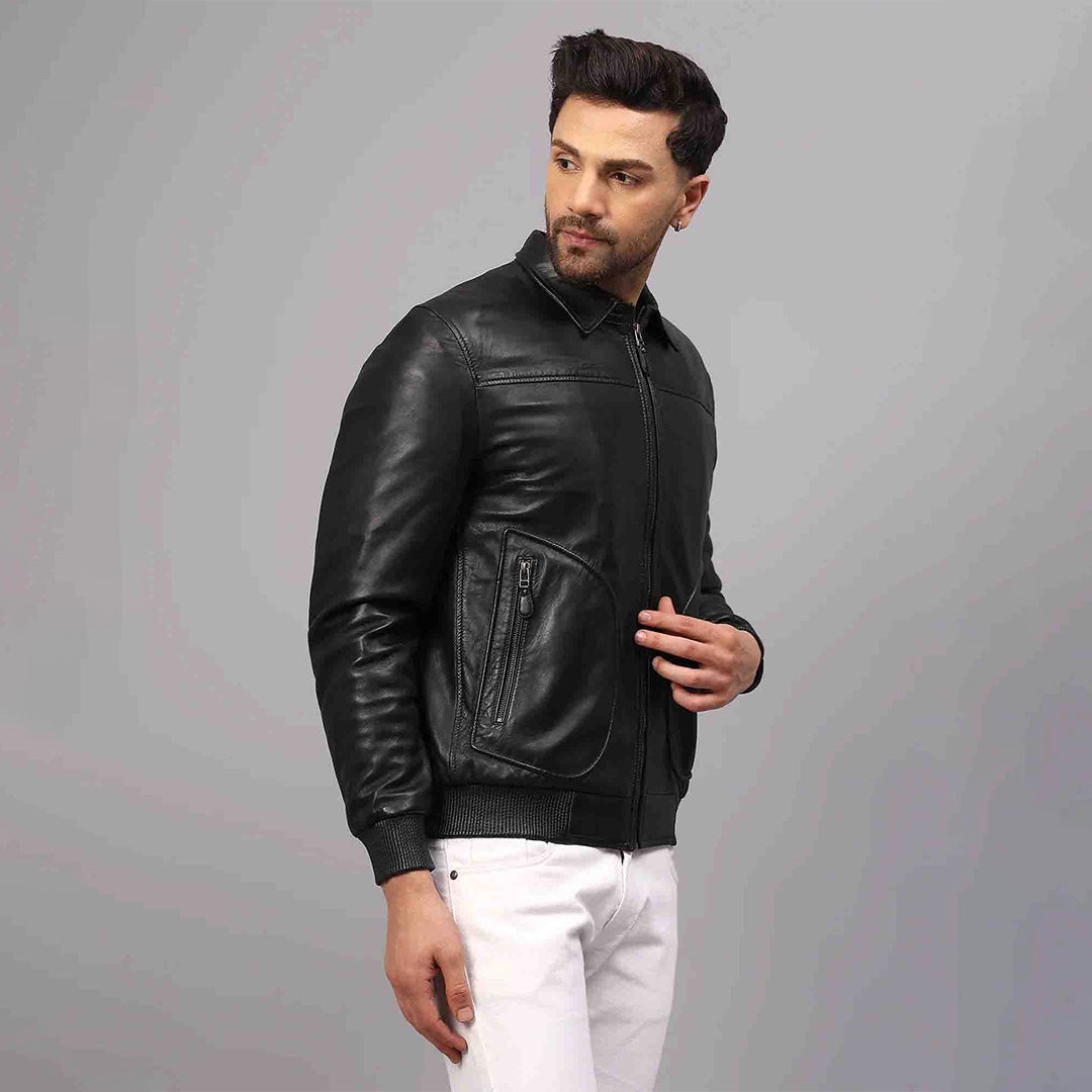 Side view of a black leather bomber jacket showing the zip pocket detail.
