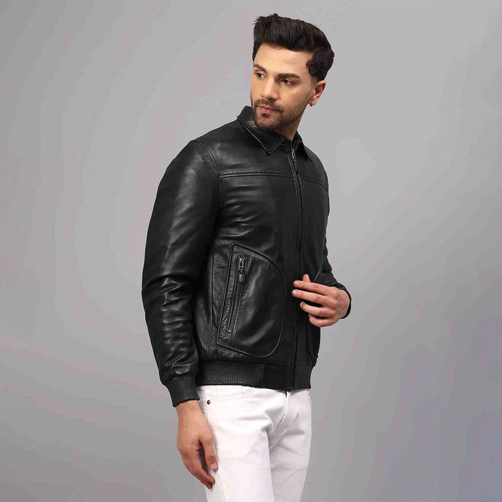 Side view of a black leather bomber jacket showing the zip pocket detail.