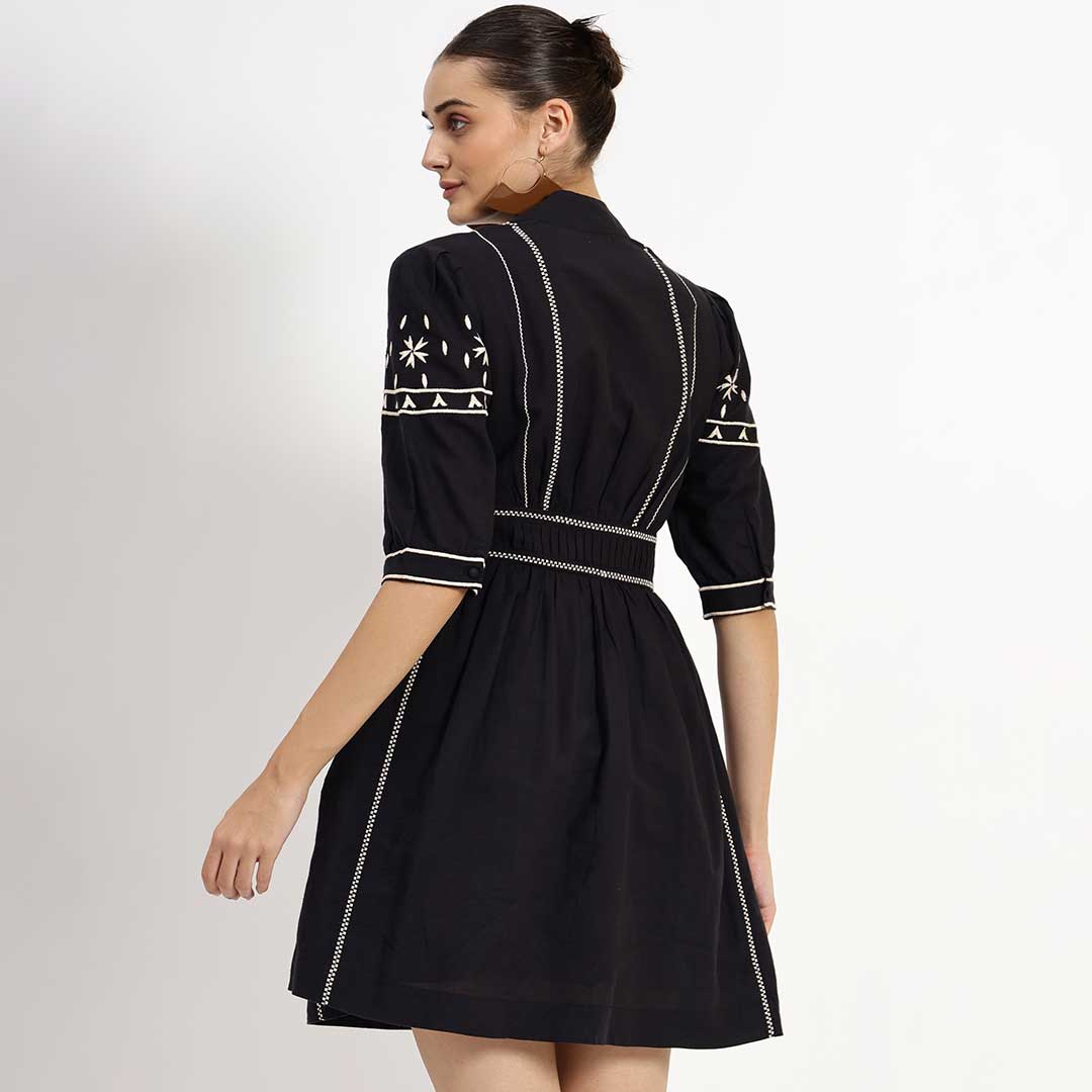 Women's black embroidered linen dress by Saint Ayleen, back view.