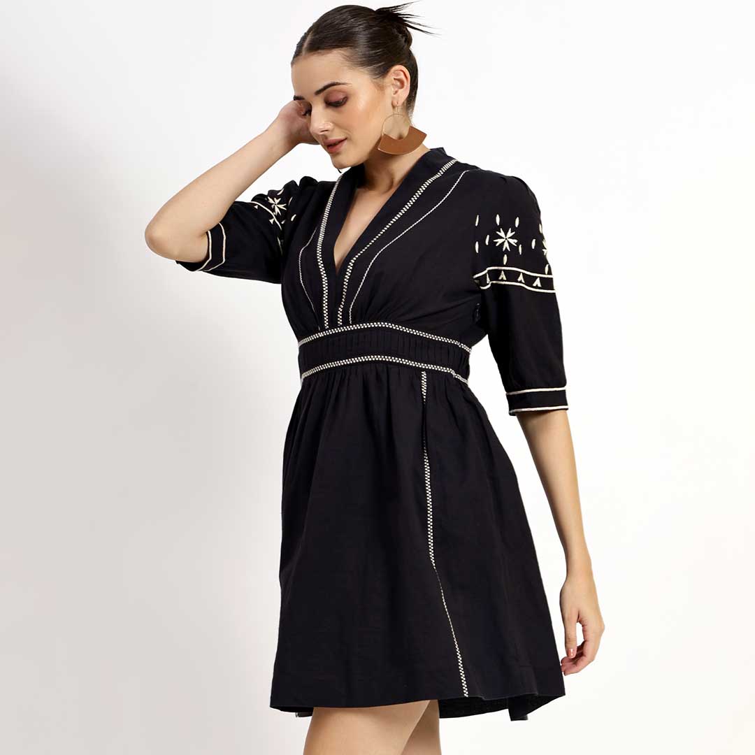 Women's black embroidered linen dress by Saint Ayleen, three-quarter front view.