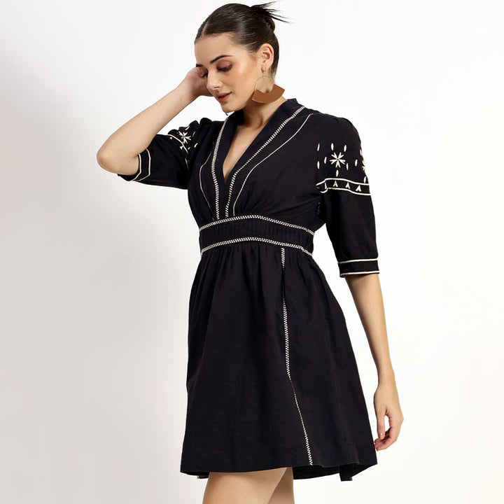Women's black embroidered linen dress by Saint Ayleen, three-quarter front view.
