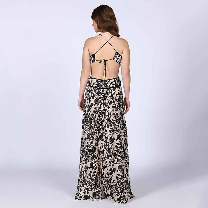 Women's black floral cutout waist maxi dress by Saint, three-quarter front view.
